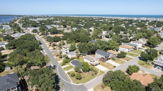 bird's eye view with a water view and a residential view