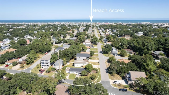 bird's eye view featuring a water view and a residential view