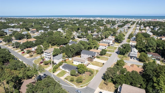 birds eye view of property with a residential view and a water view