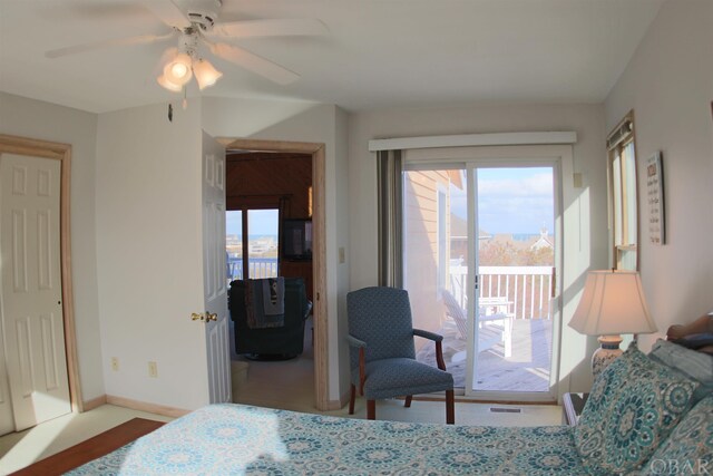 bedroom featuring access to outside, baseboards, and ceiling fan