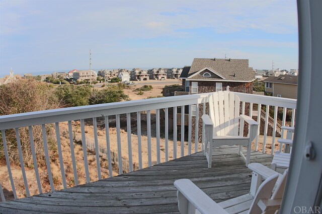 wooden deck with a residential view