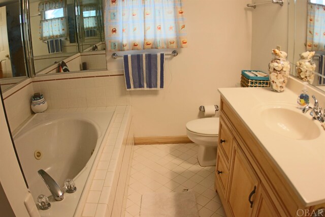 full bath featuring toilet, vanity, baseboards, tile patterned floors, and a tub with jets