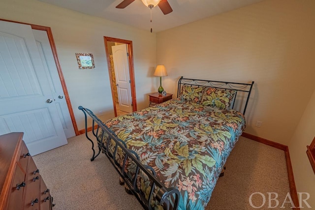 bedroom with ceiling fan and baseboards