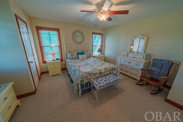 bedroom with baseboards, a ceiling fan, and light colored carpet