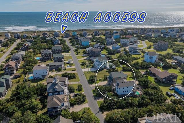 aerial view featuring a water view and a residential view