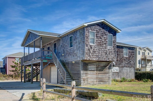 view of front of house featuring stairway