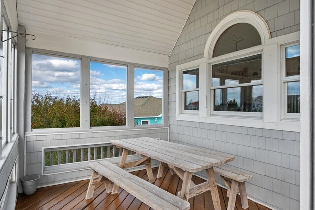 sunroom / solarium with vaulted ceiling