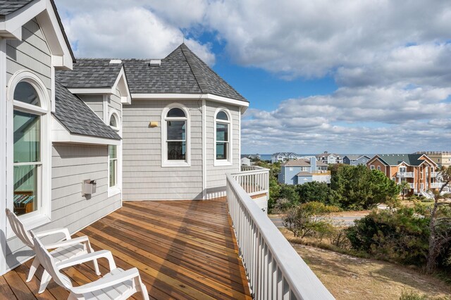 wooden terrace with a residential view