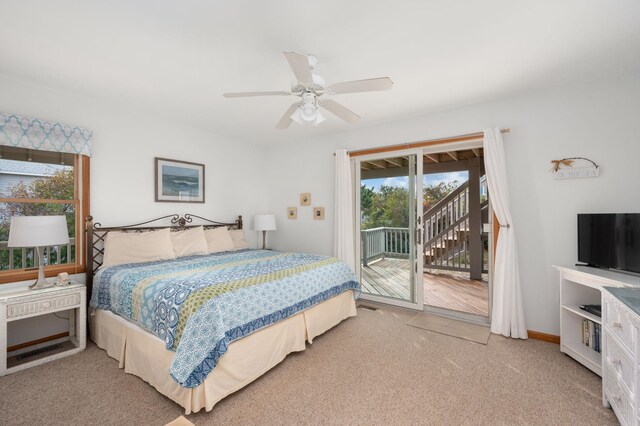 bedroom featuring access to exterior, light colored carpet, ceiling fan, and baseboards