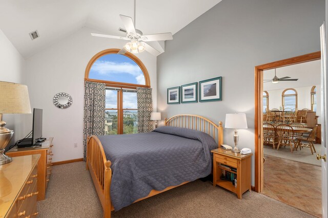 bedroom with high vaulted ceiling, light colored carpet, ceiling fan, and baseboards