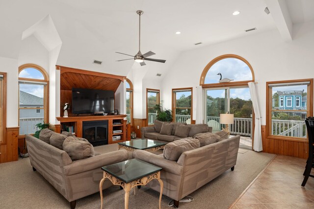 living room with a wainscoted wall and wood walls