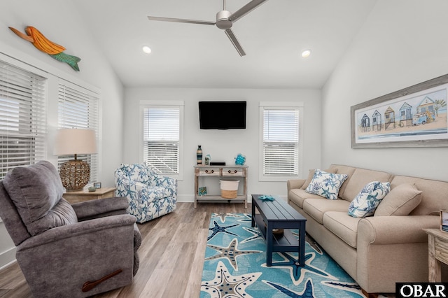 living area with a ceiling fan, vaulted ceiling, wood finished floors, and recessed lighting