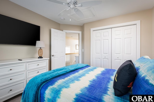 bedroom featuring attic access, a closet, and ceiling fan