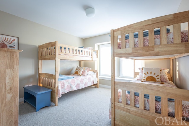 bedroom with carpet flooring and baseboards