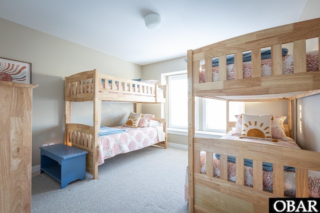 carpeted bedroom with baseboards