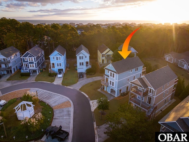 birds eye view of property with a residential view