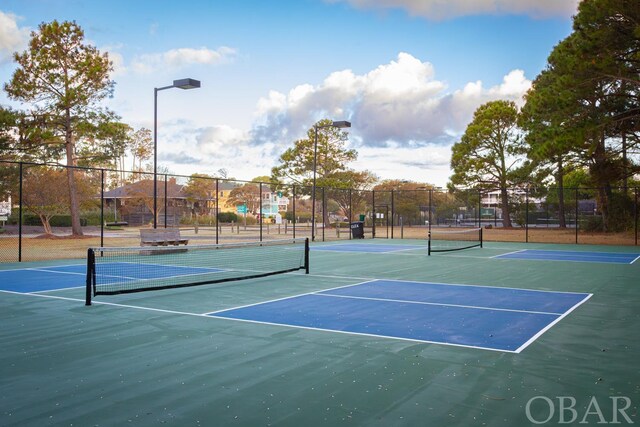 view of sport court with fence