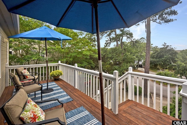 1127 Brumsey Ct Lot 324, Corolla, NC 27927 - wooden terrace with view of scattered trees