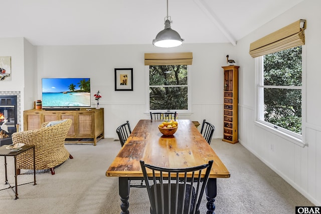 1127 Brumsey Ct Lot 324, Corolla, NC 27927 - dining area featuring light carpet, a wainscoted wall, and a fireplace
