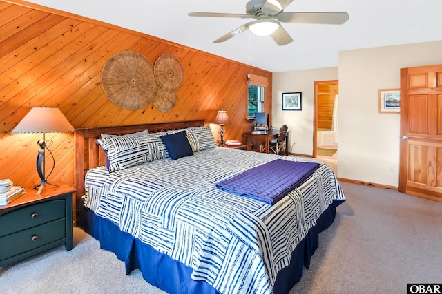 1127 Brumsey Ct Lot 324, Corolla, NC 27927 - bedroom featuring carpet, wooden walls, ceiling fan, and ensuite bathroom