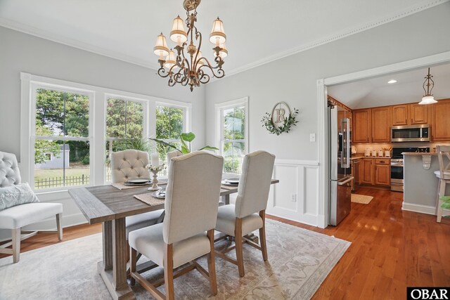109 Cooper Landing Dr Lot 7, Aydlett, NC 27916 - dining space with crown molding, a chandelier, wainscoting, dark wood finished floors, and recessed lighting