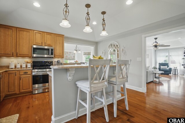 109 Cooper Landing Dr Lot 7, Aydlett, NC 27916 - kitchen featuring appliances with stainless steel finishes, plenty of natural light, light stone counters, wood finished floors, and recessed lighting