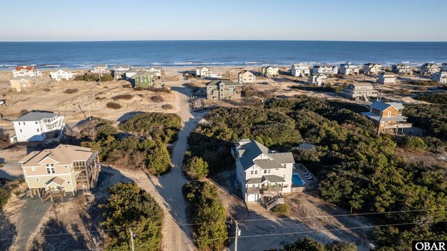 drone / aerial view with a water view and a residential view