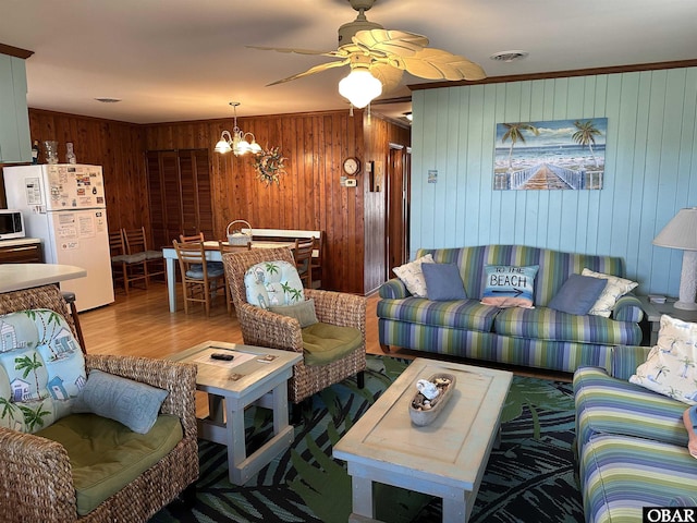 1232 S Virginia Dare Trl Lot 6, Kill Devil Hills, NC 27948 - living area featuring wood finished floors, wooden walls, ceiling fan, and a chandelier