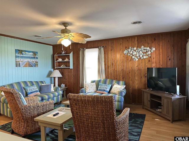 1232 S Virginia Dare Trl Lot 6, Kill Devil Hills, NC 27948 - living room featuring crown molding, ceiling fan, light wood-style flooring, and wood walls
