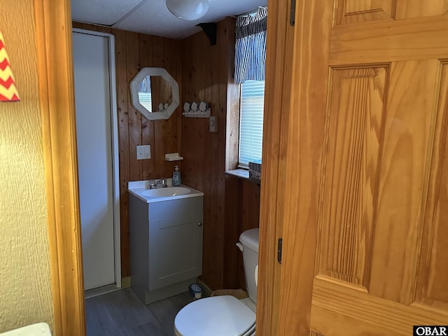 1232 S Virginia Dare Trl Lot 6, Kill Devil Hills, NC 27948 - bathroom featuring toilet, wooden walls, vanity, and wood finished floors