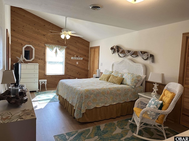 1232 S Virginia Dare Trl Lot 6, Kill Devil Hills, NC 27948 - bedroom with wood walls, hardwood / wood-style floors, lofted ceiling, and ceiling fan