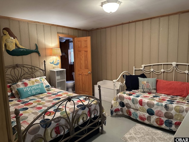 1232 S Virginia Dare Trl Lot 6, Kill Devil Hills, NC 27948 - bedroom featuring concrete flooring, wooden walls, and ornamental molding