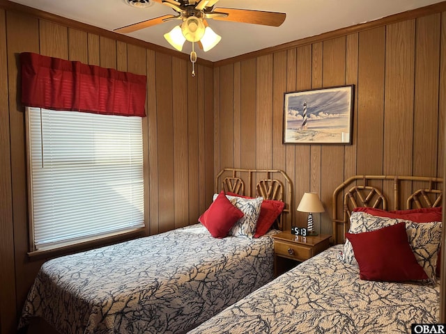 1232 S Virginia Dare Trl Lot 6, Kill Devil Hills, NC 27948 - bedroom with wood walls, a ceiling fan, and ornamental molding