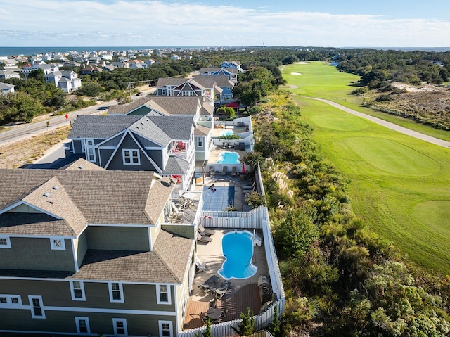 drone / aerial view featuring a residential view and golf course view