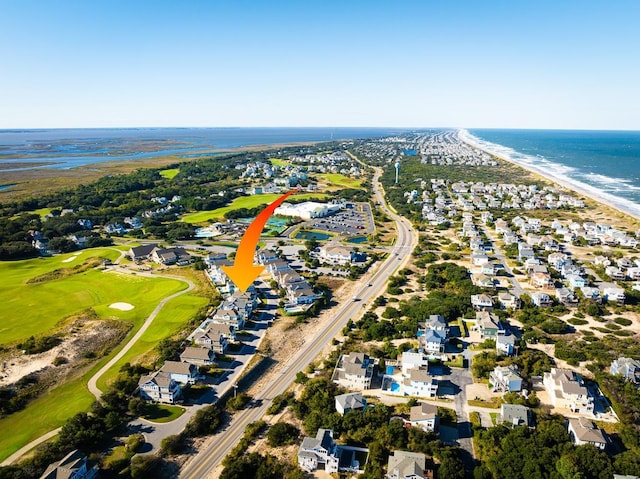 drone / aerial view featuring a water view, a residential view, and golf course view