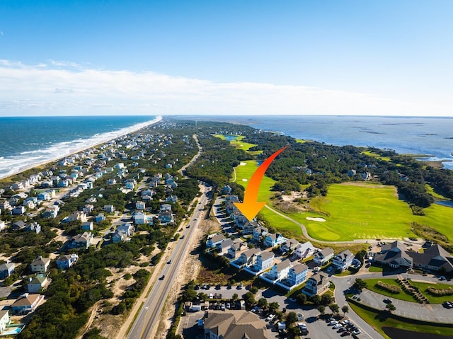 aerial view with a residential view, view of golf course, and a water view