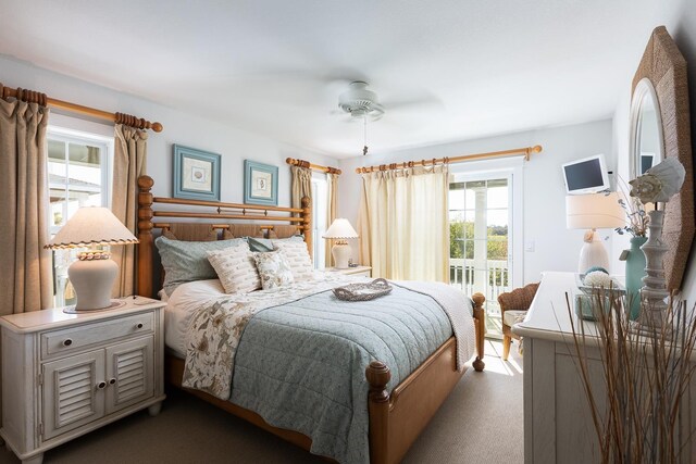 carpeted bedroom featuring ceiling fan and access to exterior