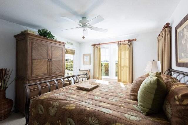 bedroom with ceiling fan and access to outside