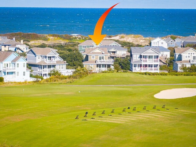 exterior space with a water view and golf course view