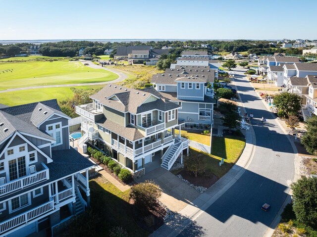 bird's eye view featuring view of golf course and a residential view