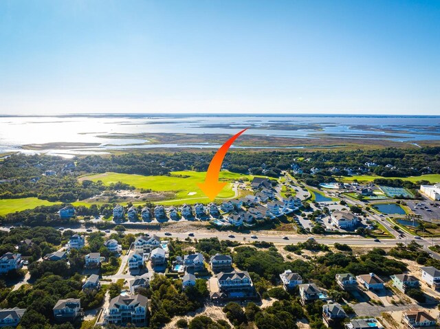 birds eye view of property with a water view and a residential view