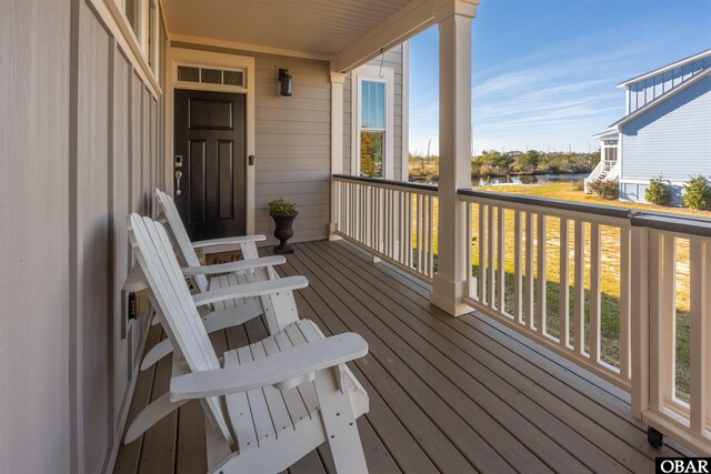 deck featuring a water view