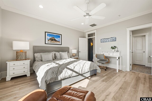 bedroom featuring visible vents, light wood-style flooring, baseboards, and ornamental molding