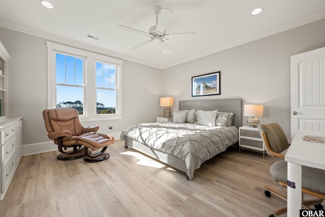 bedroom featuring crown molding, baseboards, visible vents, and light wood finished floors