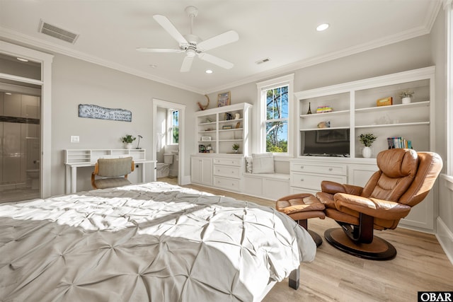 bedroom featuring visible vents, light wood-style floors, and crown molding