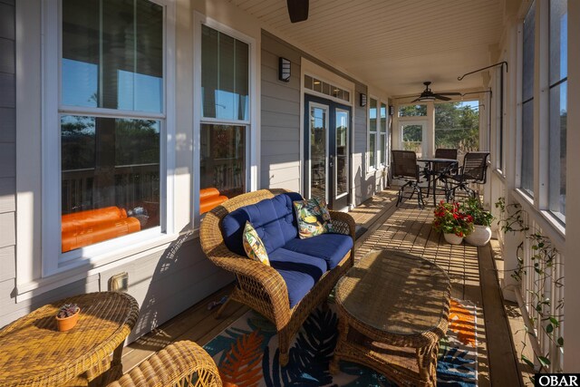 exterior space with wood ceiling and ceiling fan