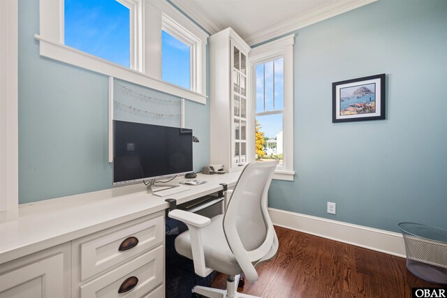 office area with dark wood finished floors, crown molding, and baseboards