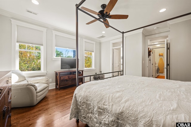 bedroom featuring crown molding, multiple windows, wood finished floors, and visible vents