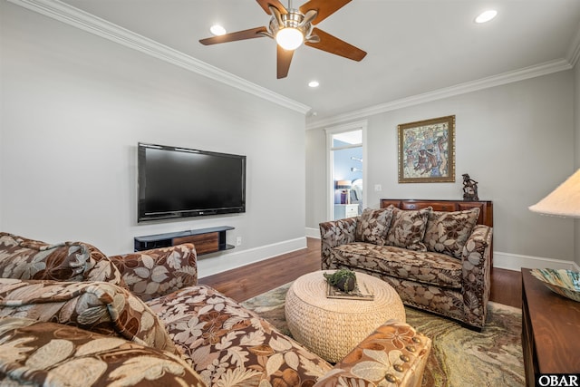 living room featuring crown molding, wood finished floors, and baseboards