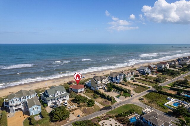 bird's eye view with a water view, a residential view, and a view of the beach